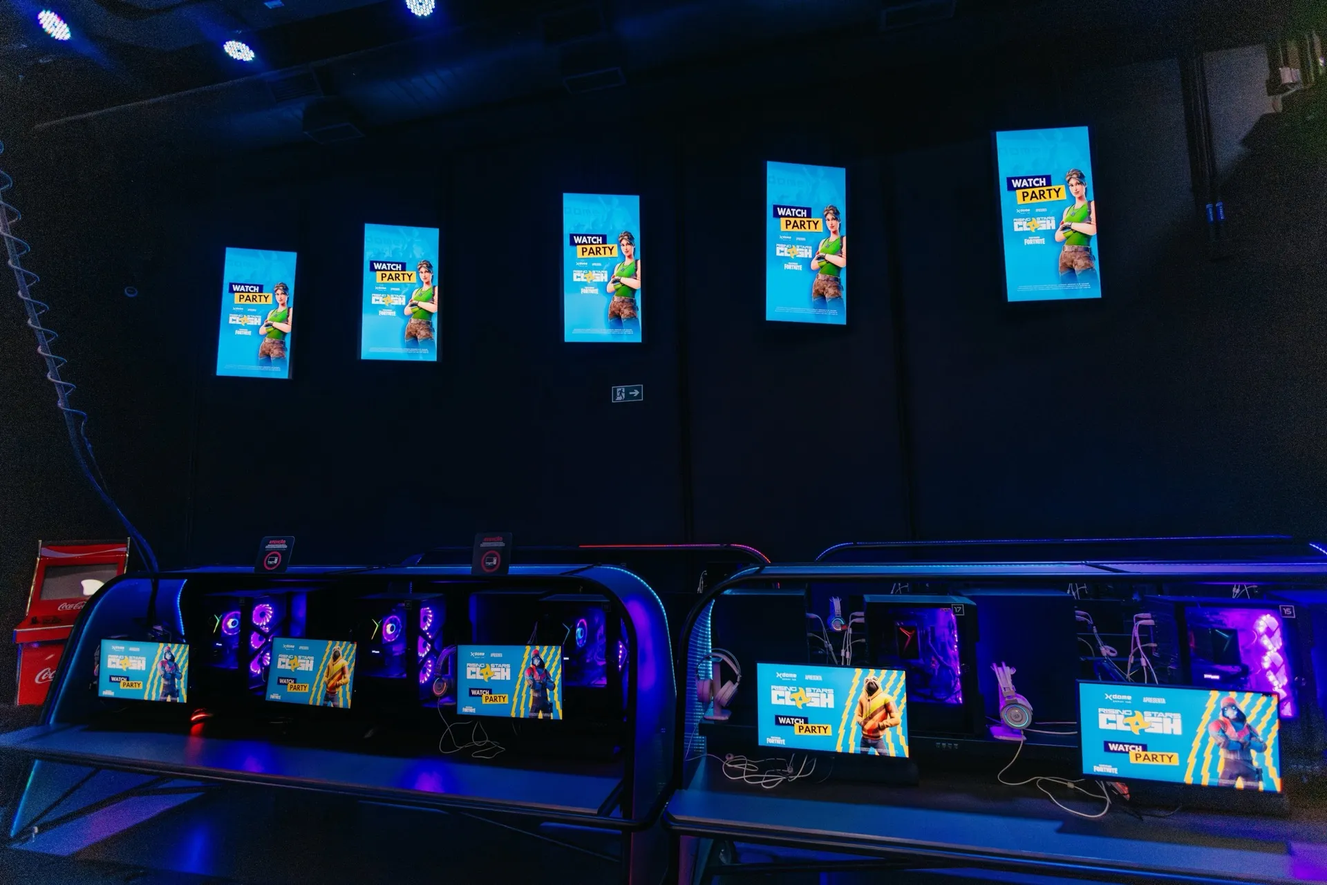 Rows of gaming stations glowing at Rising Stars